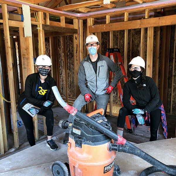 Image of 3 UCSF Radiology residents participating in Habitat for Humanity 
