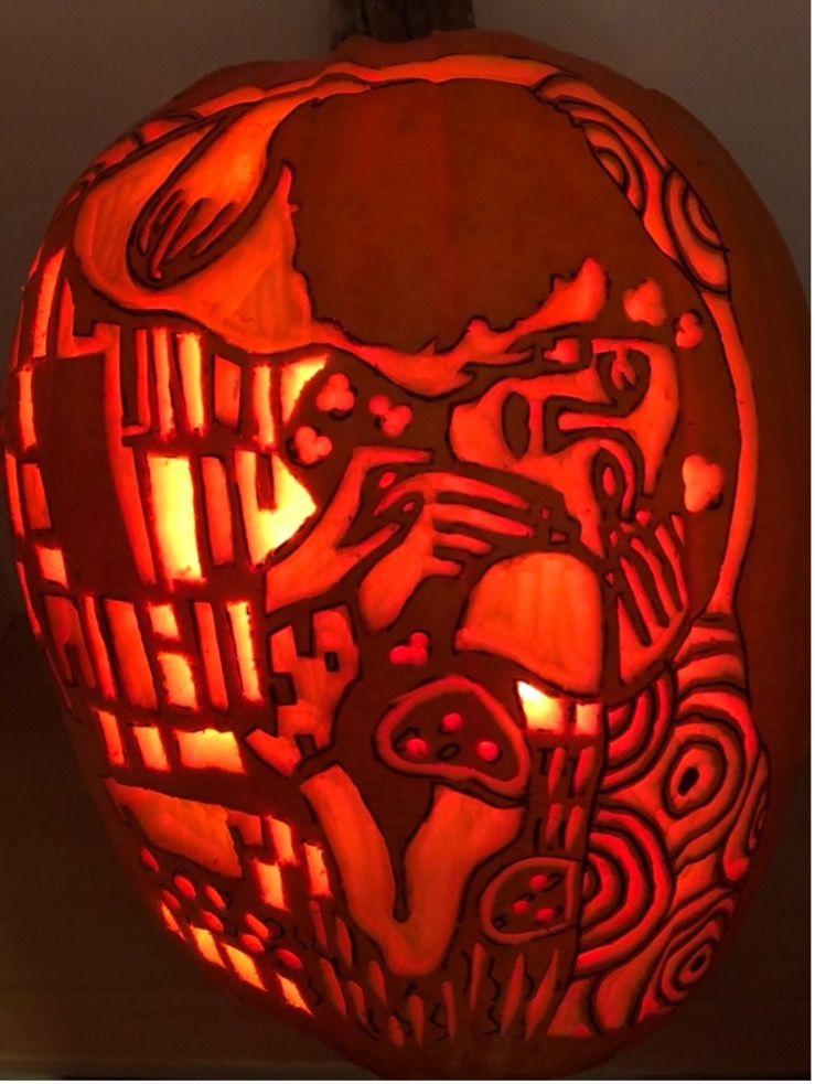 One of Dr. Vella’s intricate carved pumpkins is based on the painting The Kiss by the artist Gustav Klimt.