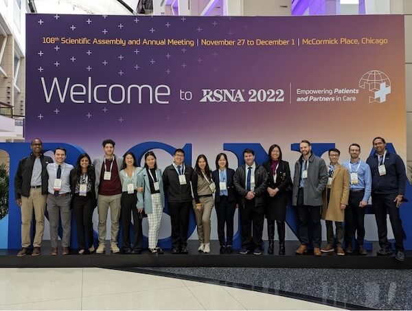 UCSF Radiology team members pose in front of the welcome sign at RSNA 2022.