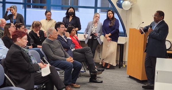 Executive Vice Chancellor and Provost Catherine Lucey, former chair Ron Arenson, Chair Chris Hess, and Vice Chair Sharmila Majumdar listen to Dean Talmodge King at 20th Anniversary