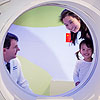 Young patient getting familiar with a SPECT-CT scanner