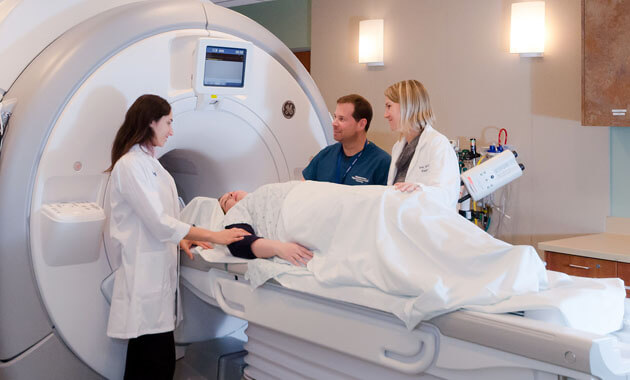 Radiology staff preparing a patient for an MRI exam